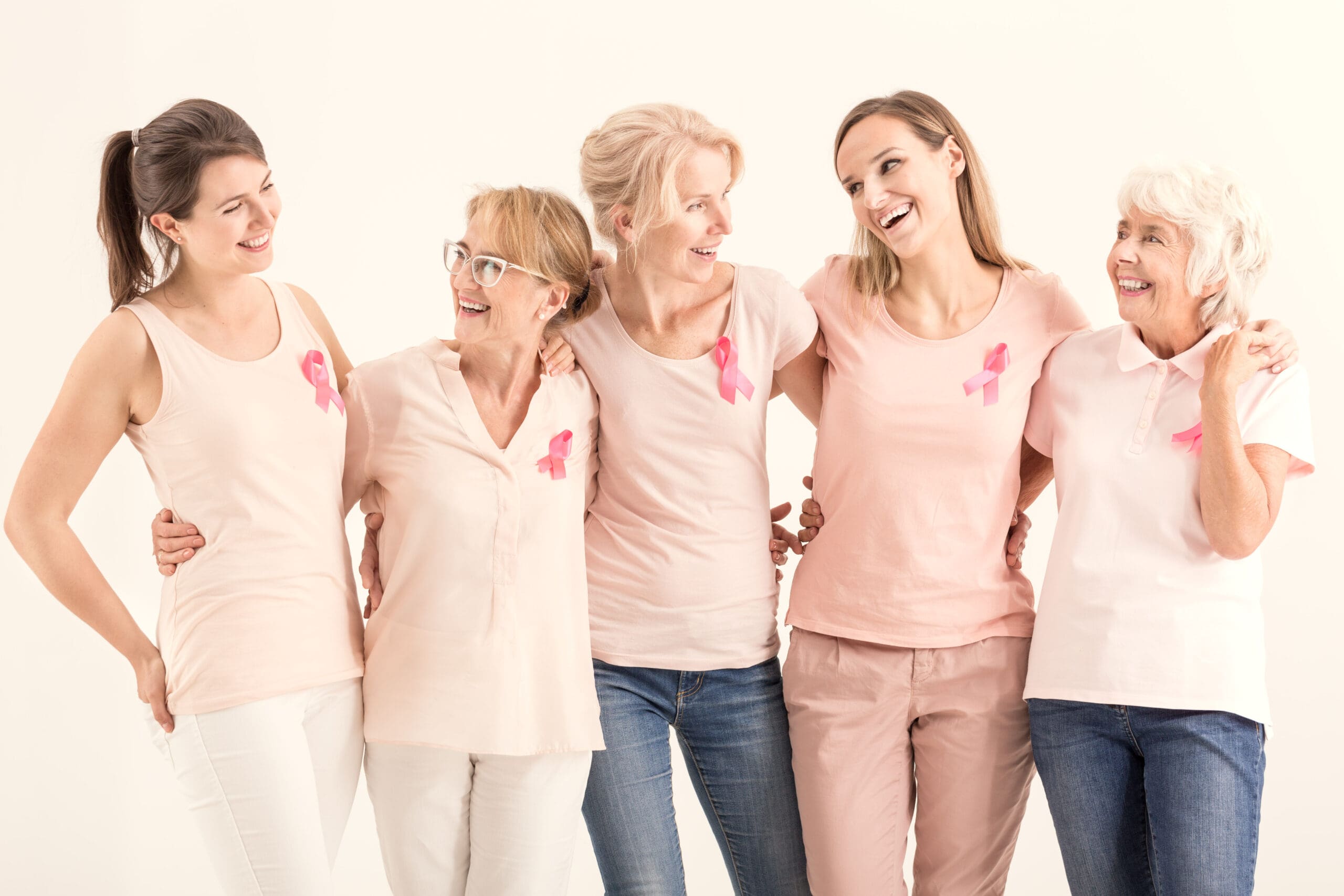 Breast cancer awareness group of women wearing pink ribbon.