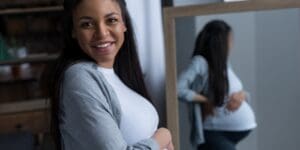 Cheerful African American Pregnant Woman Standing